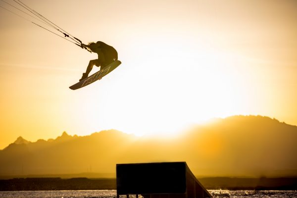 Mixing art with the commercial needs of clients isn’t always that easy; the careful dance between natural light, camera flash and exposure is what it takes to get Alexander Lewis-Hughes’ sponsor to pop in this backlit silhouette grab.