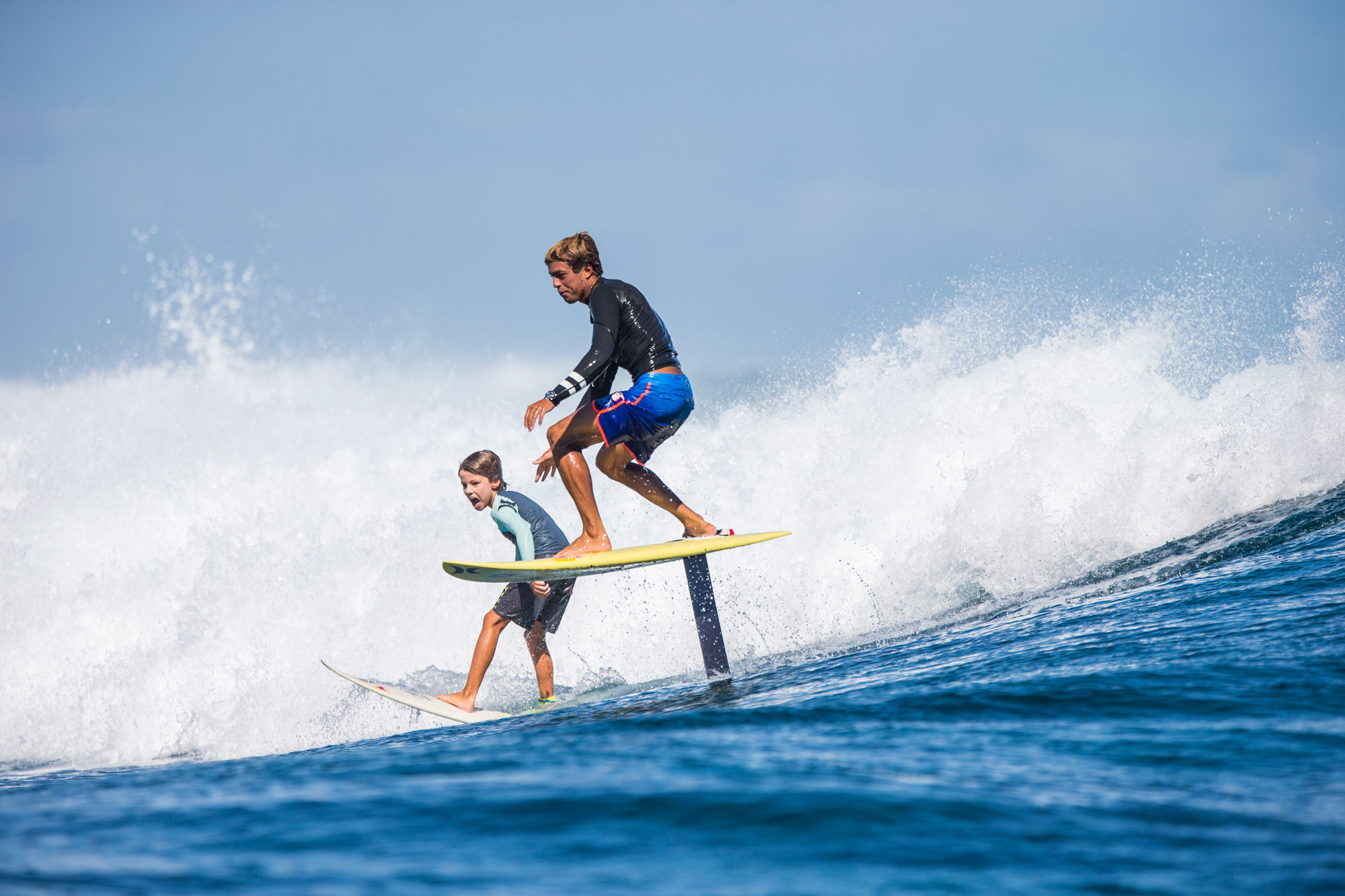 Kai shoulder hopping a friend’s wave while illustrating a hydrofoil’s preference for a completely different domain than a shortboard. // Photo Tom Servais
